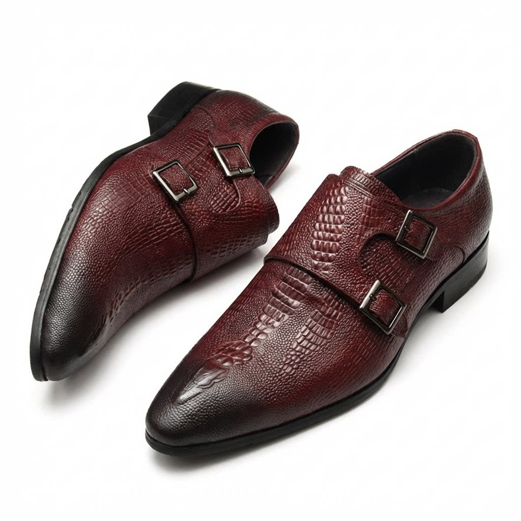 Elegant burgundy crocodile patterned leather double monk strap shoes with a sleek silhouette.