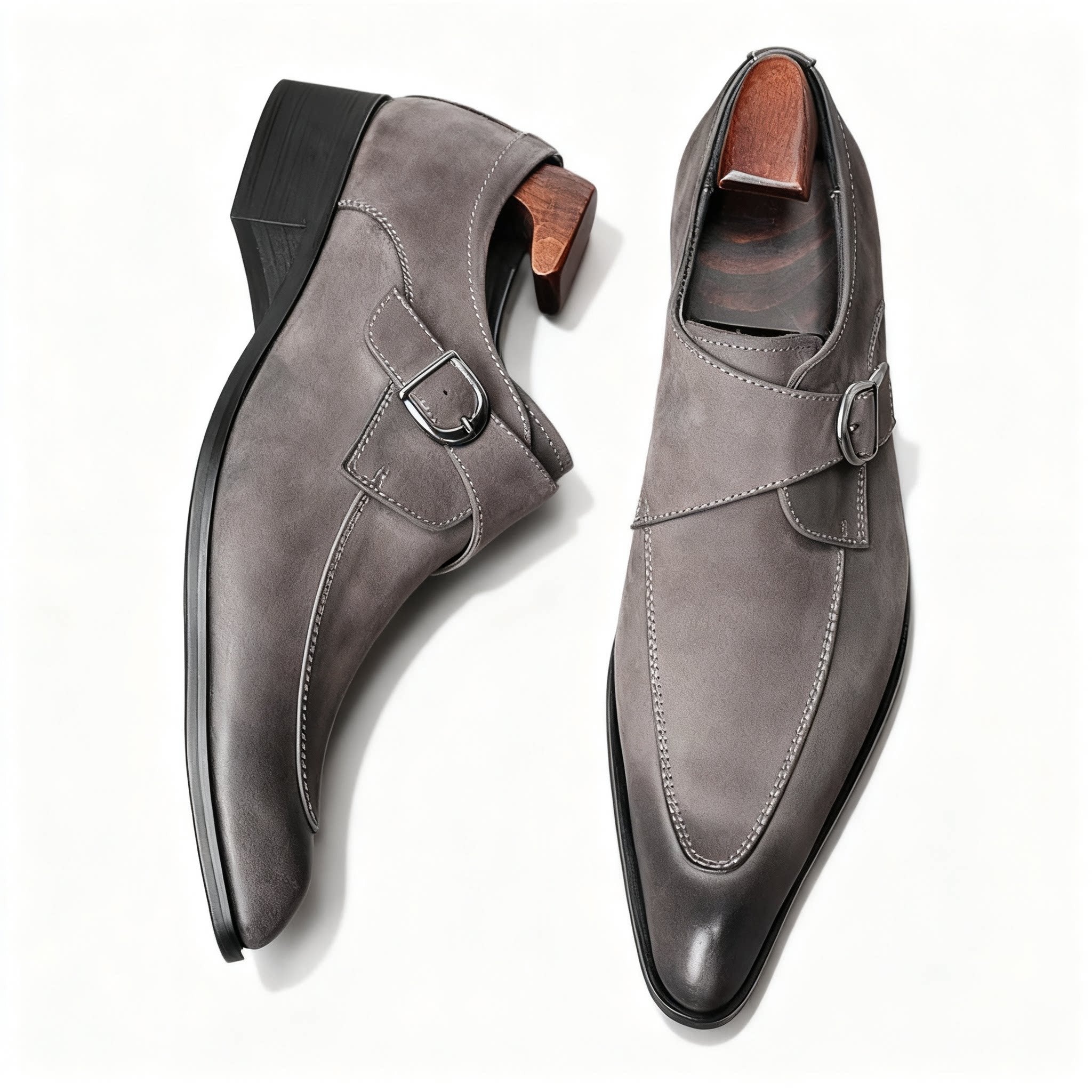 Elegant grey plain toe monk strap shoes with a minimalist silhouette and rubber sole.