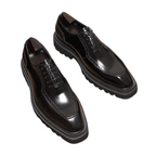Men's chunky lug sole wingtip brogue oxfords, black leather lace-up pair