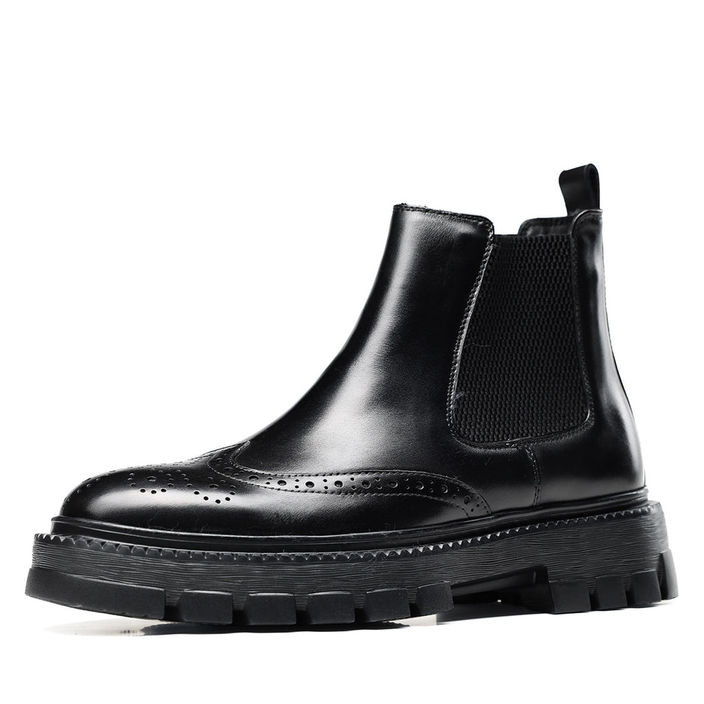 Black leather chelsea dress boots with elastic gore, wingtip brogue detailing, thick sole