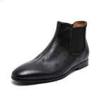 Black suede Chelsea dress boots with pointed toe and elastic side gore