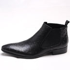 Black leather Chelsea dress boots with elastic side panels and pull tab