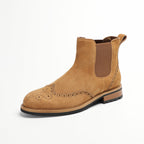 Tan suede pointed-toe Chelsea boot with elastic side panels and brogue perforations