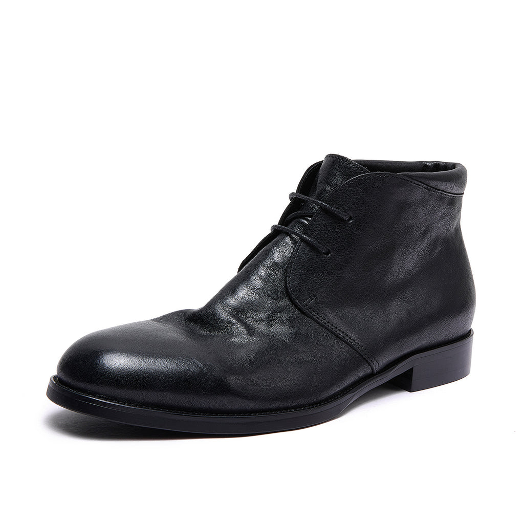 Black leather lace-up chukka boot with plain toe and low block heel.