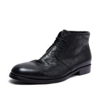 Black leather lace-up chukka boot with plain toe and low block heel.