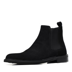 Black Chelsea dress boot with side elastic gore and low stacked heel, slip-on style.