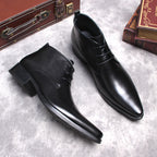 Black leather lace-up dress boots with pointed toe and low stacked heel.