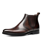 Brown leather chelsea dress boots with brogue-style toe and side elastic panels