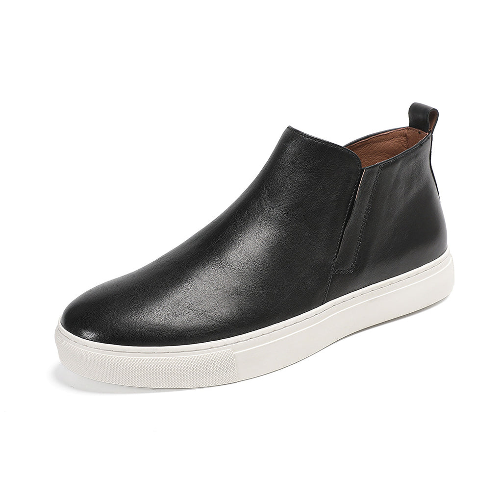 Black leather side-zip dress boot with pointed toe and white rubber sole