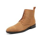 Tan suede lace-up chukka boot with plain toe and black rubber sole