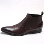 Dark brown leather Chelsea dress boots with elastic side panels and pull tab