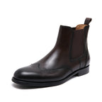 Pointed-toe dark chelsea dress boot with elastic side panel and low stacked heel