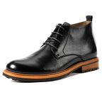 Men's black leather lace-up chukka boots with plain toe, brown welt and rubber outsole